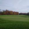 A fall day view of a green at Batteaux Creek Golf Club.