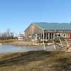 A view of the clubhouse and a green at Fox Run Golf Course.