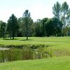 A sunny view over the water of green at Sunnybrae Golf Course