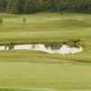 View of a green and pond at Fanshawe Golf Course