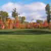 A view of green #5 guarded by colorfull fall trees at Pembroke Golf Club