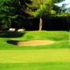 A view of a green guarded by bunkers at Blue Course from Foxwood Golf Club