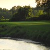 A view over the water of a green at Scenic Woods Golf and Country Club