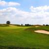 A view of a green protected by bunkers at Seven Lakes Golf Course