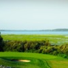 A view of a hole with water in background at King's Bay Golf and Country Club