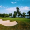 A view of a green with water in background at Dunnville Golf and Country Club