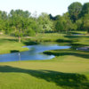 A sunny day view of a hole with water coming into play at Brampton Golf Club