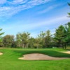A view of a hole surrounded by bunkers at Meadowbrook Golf and Country Club