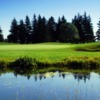 A view over the water of a green at Station Creek Golf Club (ClubCorp)