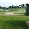 A view of hole #2 with water and bunkers coming into play at Deerfield Golf Course