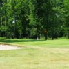 A view of a hole protected by a large bunker at Fort Erie Golf Club