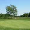 A view of a green protected by a bunker at Millcroft Golf Club.