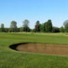 A view of a green protected by bunkers at Pine View Golf Course