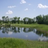 A view over the water of the 6th hole at Stonebridge Golf and Country Club