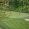 A view of a green flanked by bunkers at St. Thomas Golf and Country Club