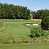 A view of green with narrow road on the left at Lakeridge Links Golf Course