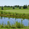 A view over the water of the 16 green at Whispering Ridge Golf Course