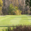 A view of a green flanked by bunkers at Clear Springs Golf Course