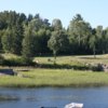 A view over the water of a green at White Moose Resort and Golf Course (Sunsetcountry)