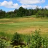 A sunny day view of a green at Pine Grove Golf Club