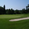 A view of a green protected by sand traps at Michipicoten Golf Club