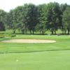 A view of the practice putting green and a hole at Talbot Trail Golf Club