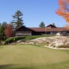 A view of the clubhouse with green in foreground at Parry Sound Golf and Country Club