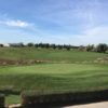 A sunny day view of a green at Sawmill Creek Golf Resort & Spa.