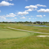 A sunny day view of a hole at Seven Lakes Golf Course.